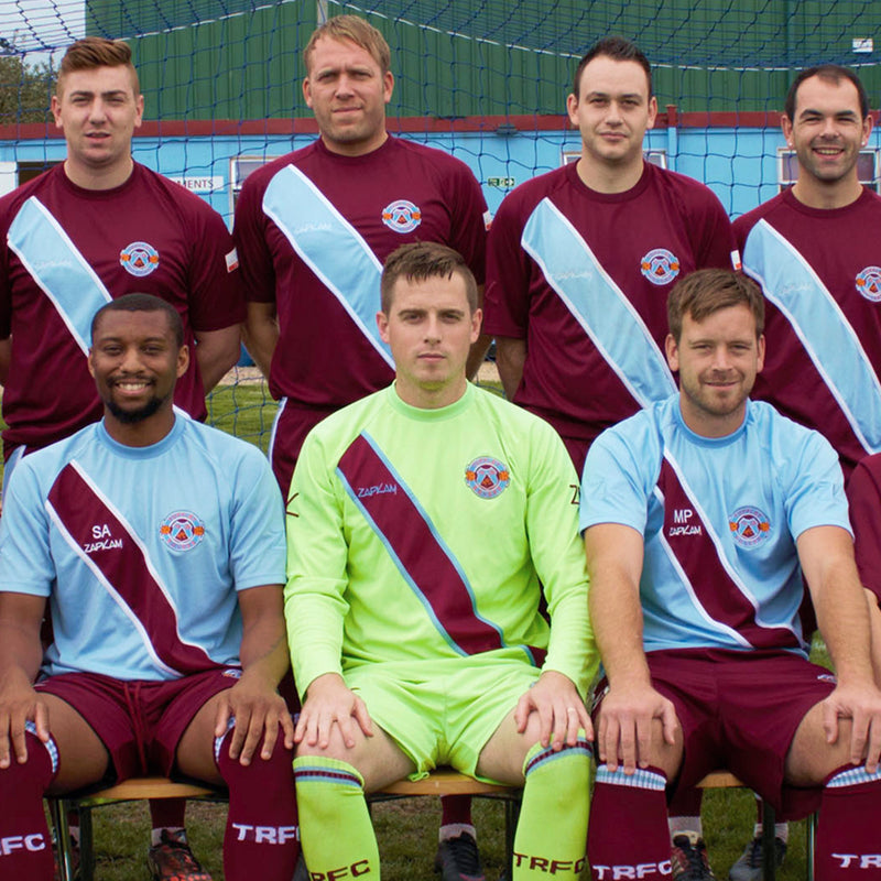 Adult soccer team in matching jerseys
