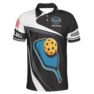Black white pickleball polo with blue paddle yellow ball graphic