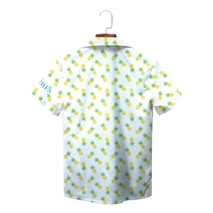 White Hawaiian shirt with yellow pineapple pattern on hanger variant 2