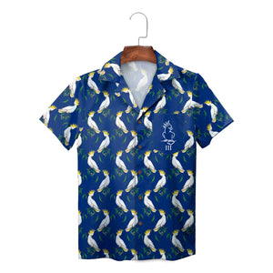 White cockatoos on blue short sleeve shirt on hanger