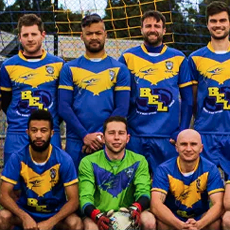 Adult soccer team in matching jerseys