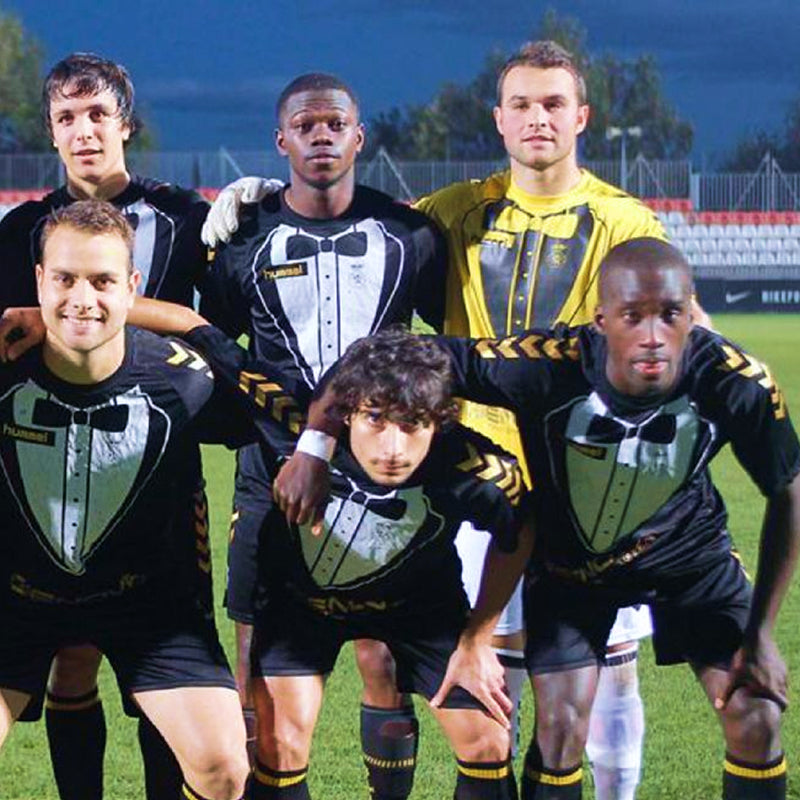 Adult soccer team in matching jerseys