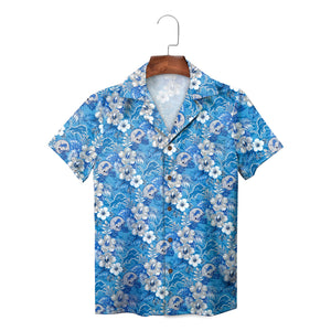 Blue tropical print button down shirt on wooden hanger