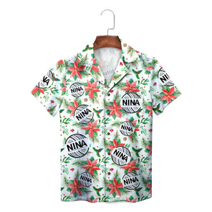 White holiday shirt showing poinsettias holly netball emblems