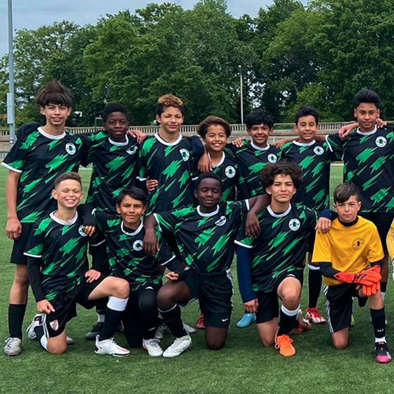 Teen soccer team in matching jerseys
