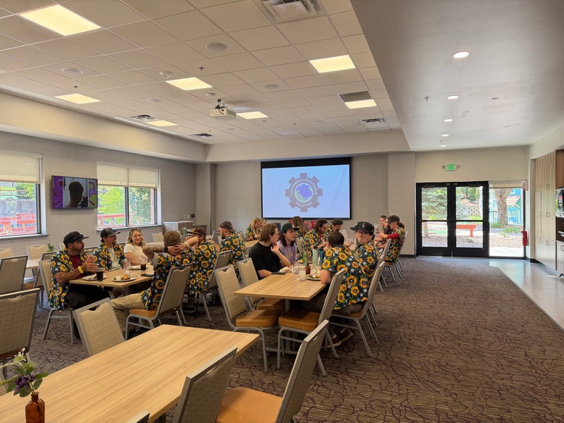Universal Controls Solution team wearing matching custom Hawaiian shirts at company event